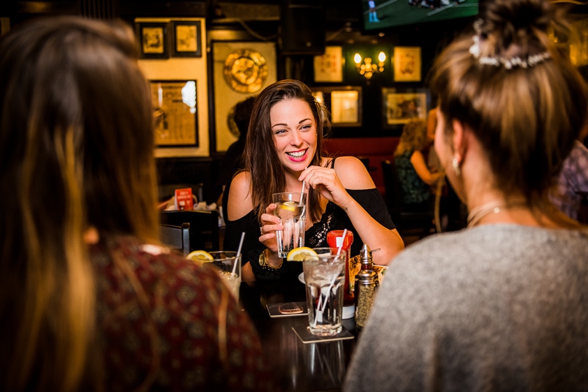 woman drinking water at Charles dickens pub