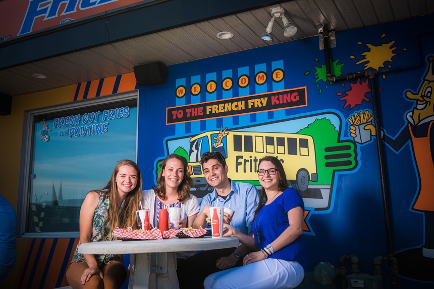 group of people gathered around a table at Fritzies