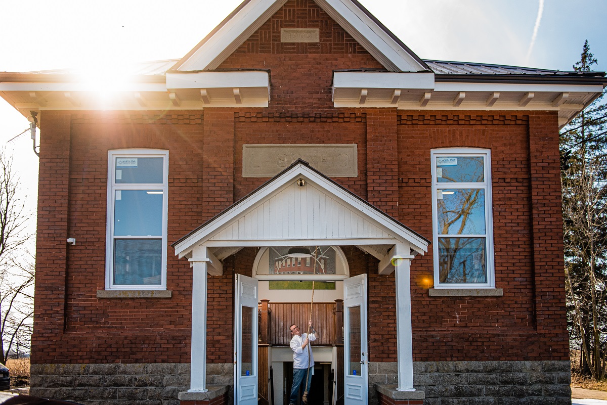 Chef Murray Zehr pulling school bell