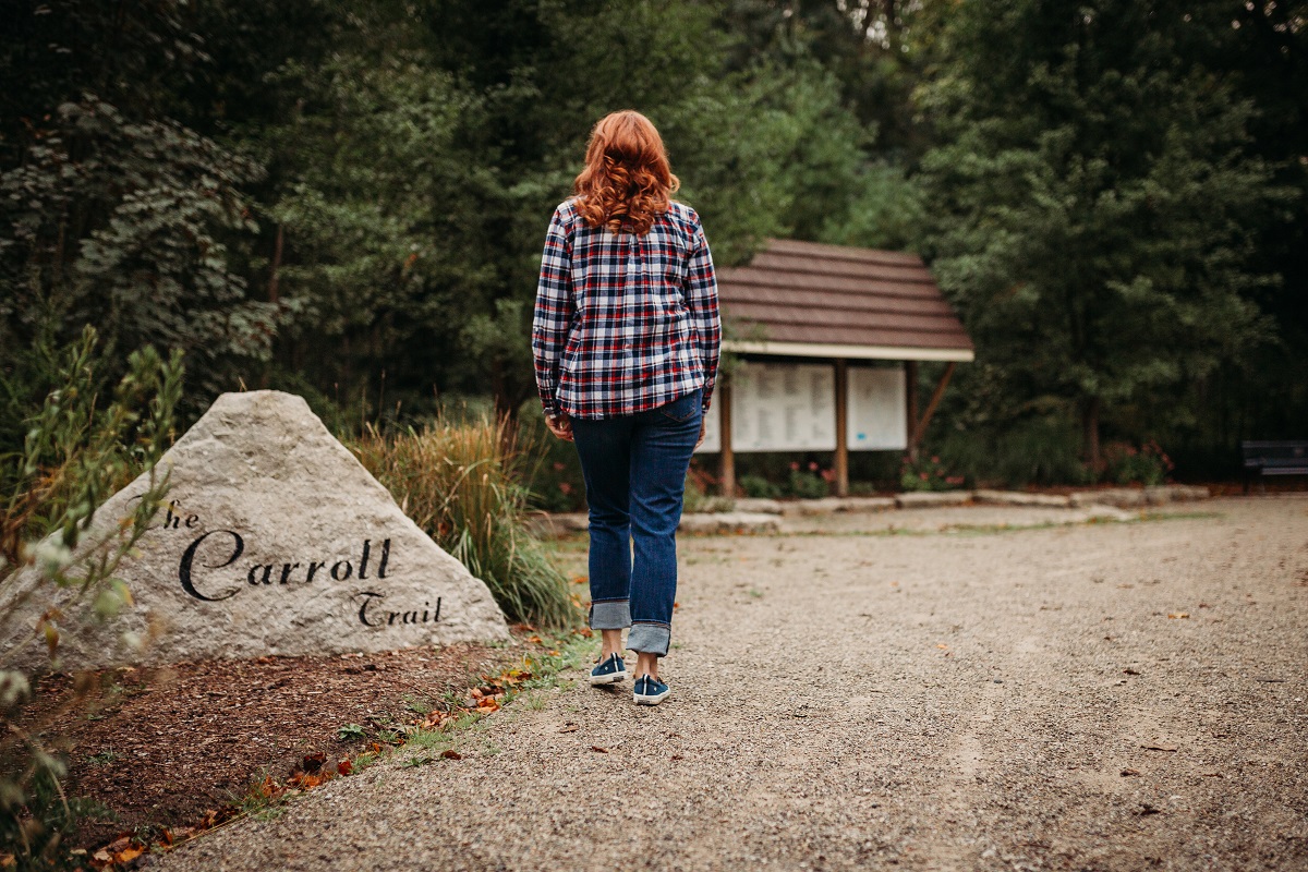 Shelley walking on the Carroll Trail, photograph taken from behind