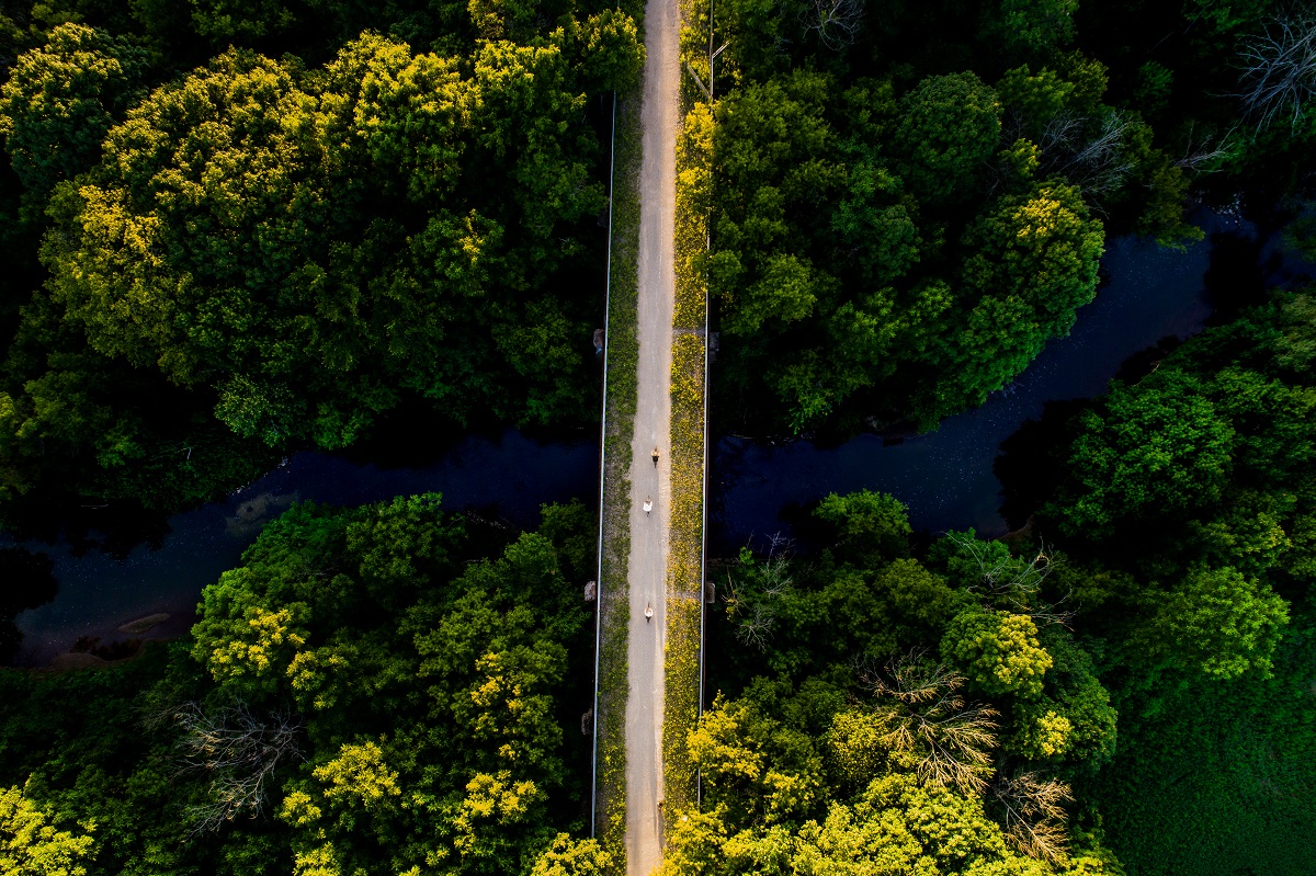 drone shot of cyclists biking on The Great Trail in Oxford County