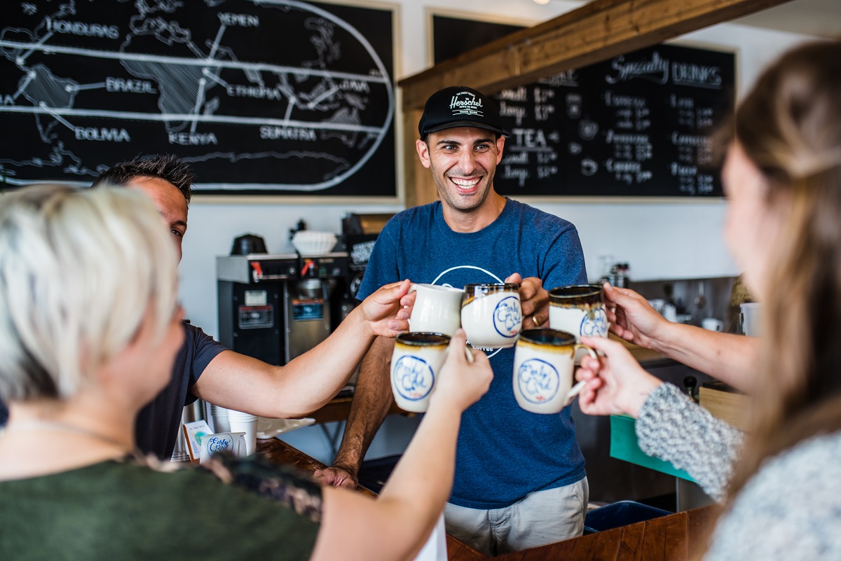 cheersing coffee at early bird coffee