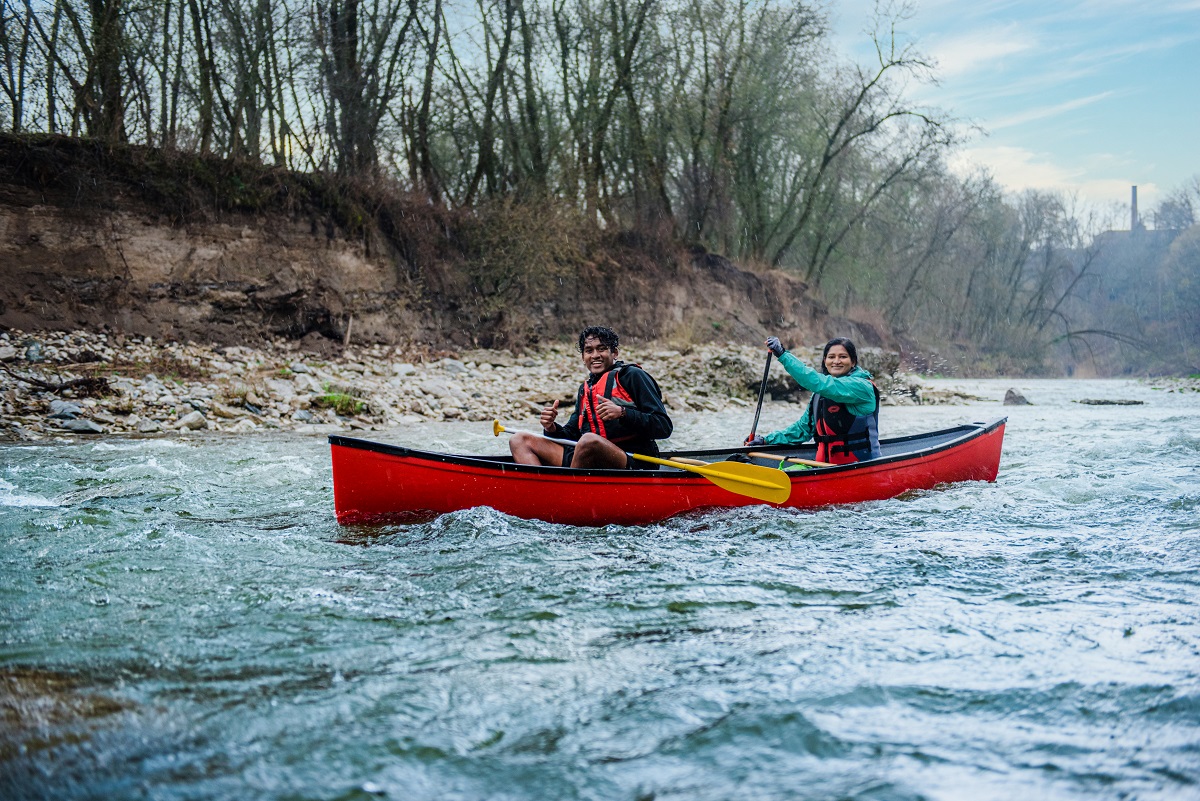 couple paddling in a canoe