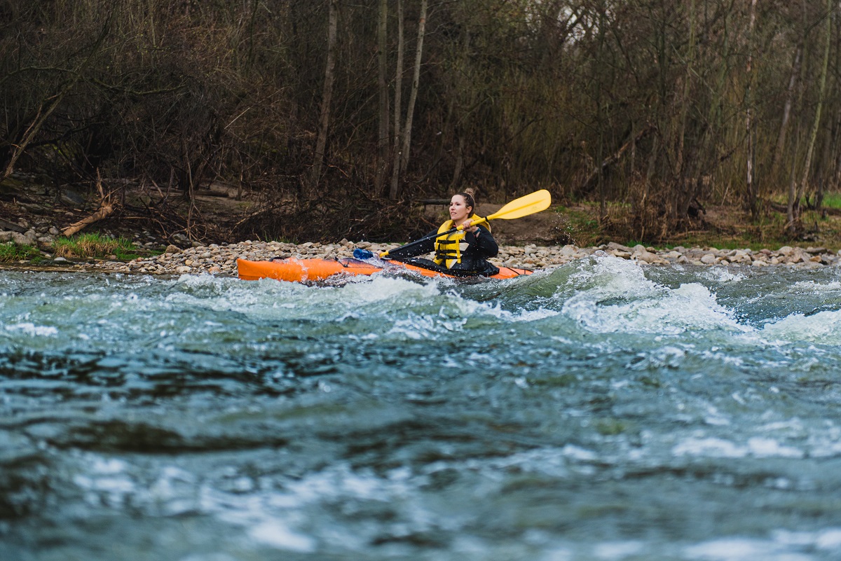 paddling the rapids ina kayak