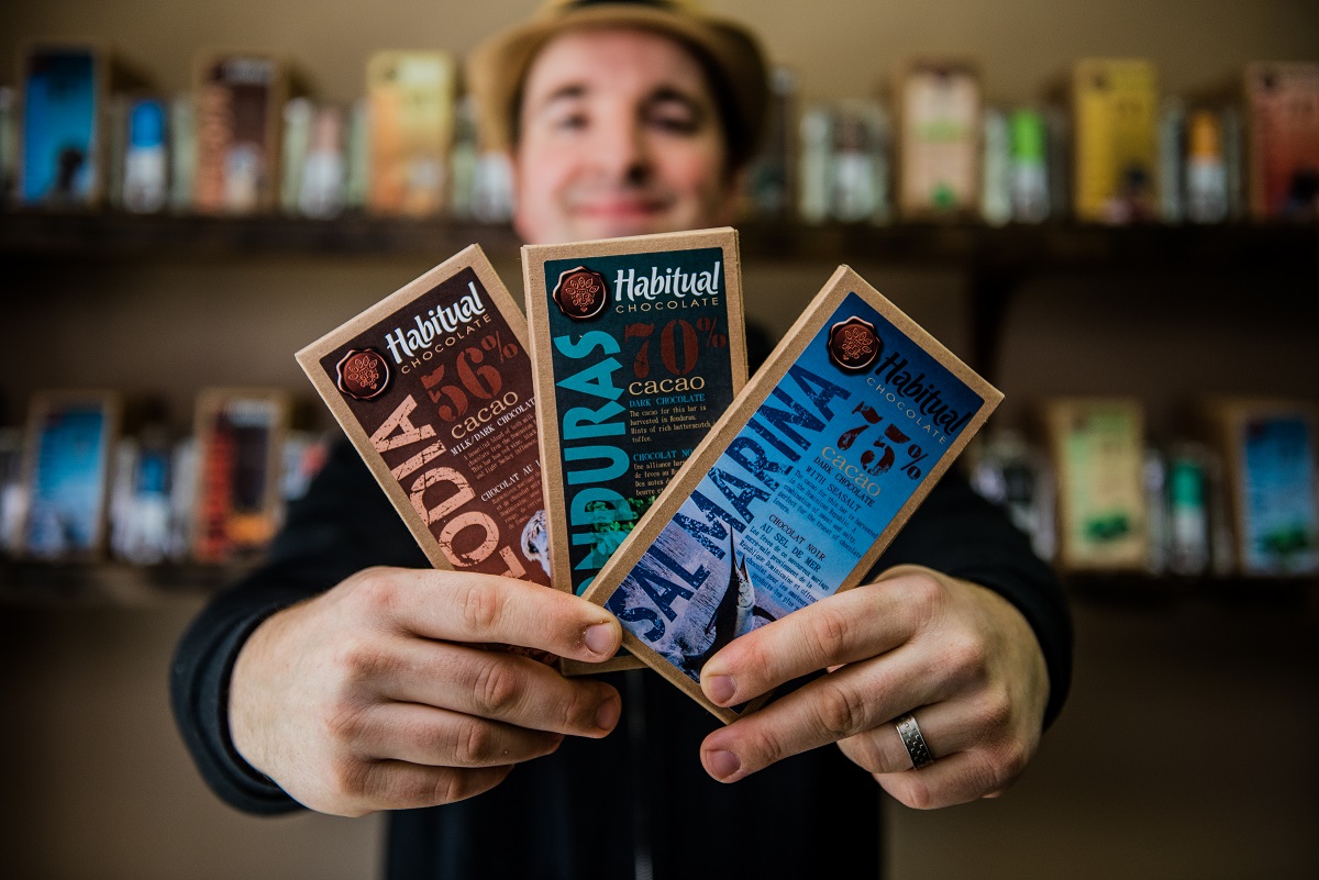Philippe from habitual holding chocolate bars