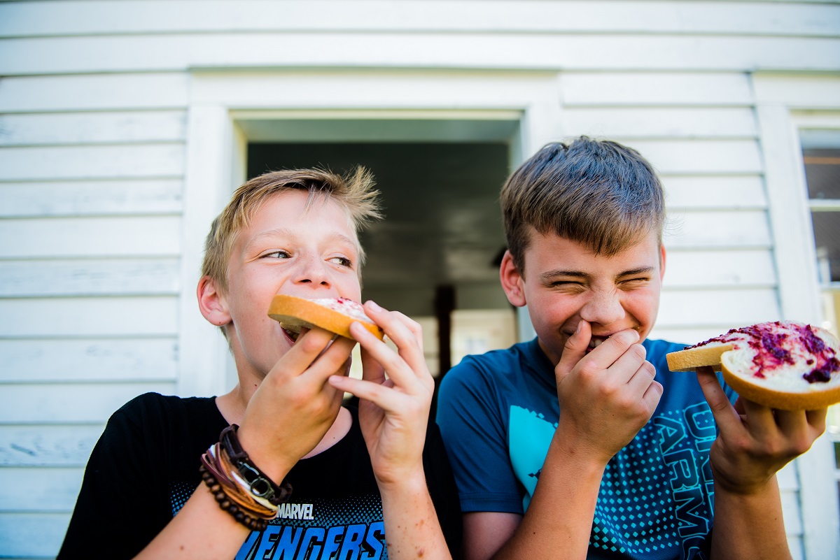 norwich museum two boys eating fresh bread with freshly churned butter and jam