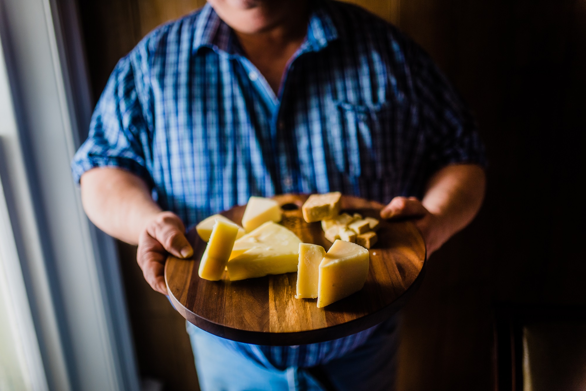 ellis holding tray of cheese