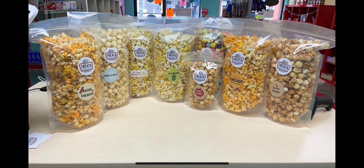 lineup of popcorn at reel treats