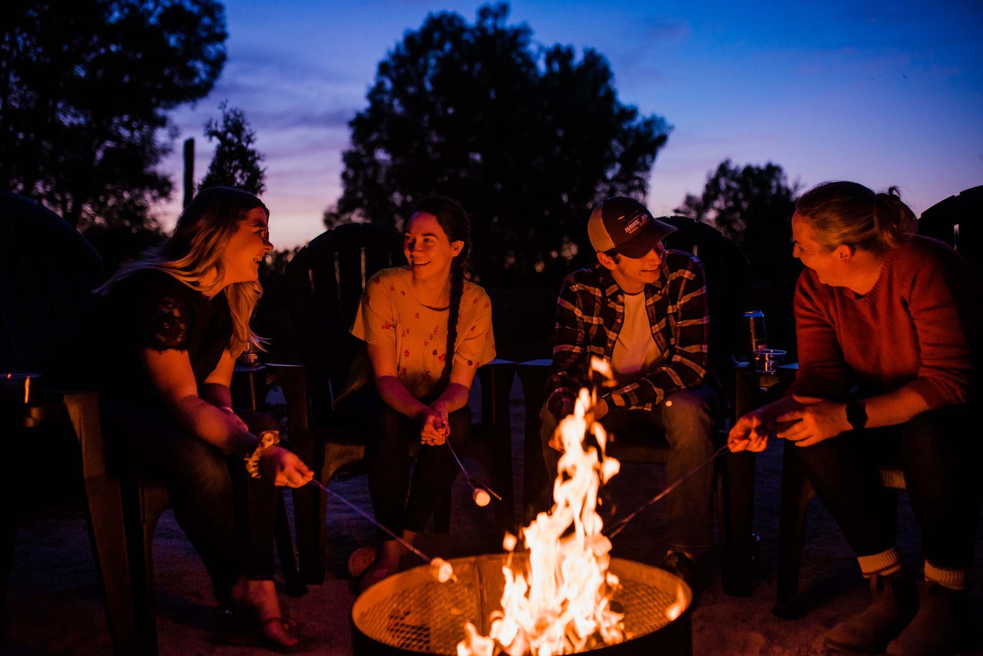 snyders campfire experience, four friends around fire
