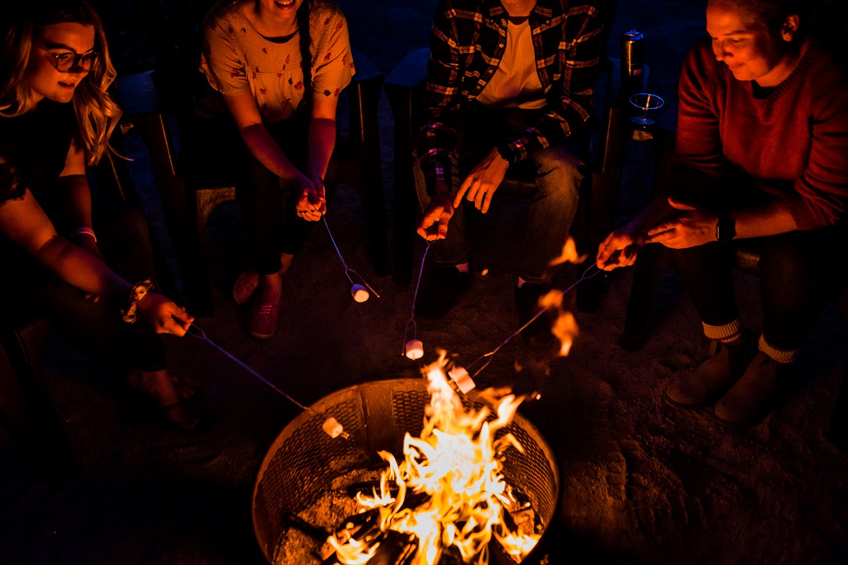 snyders teen friends around a campfire