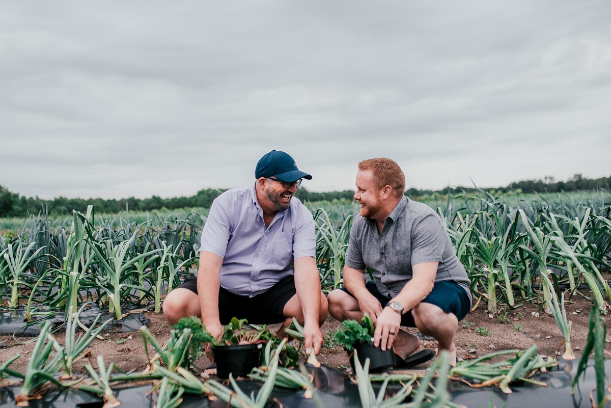 jason and partner picking veggies