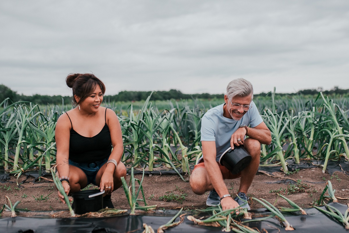 agatha and her partner pick veggies at thames river melons