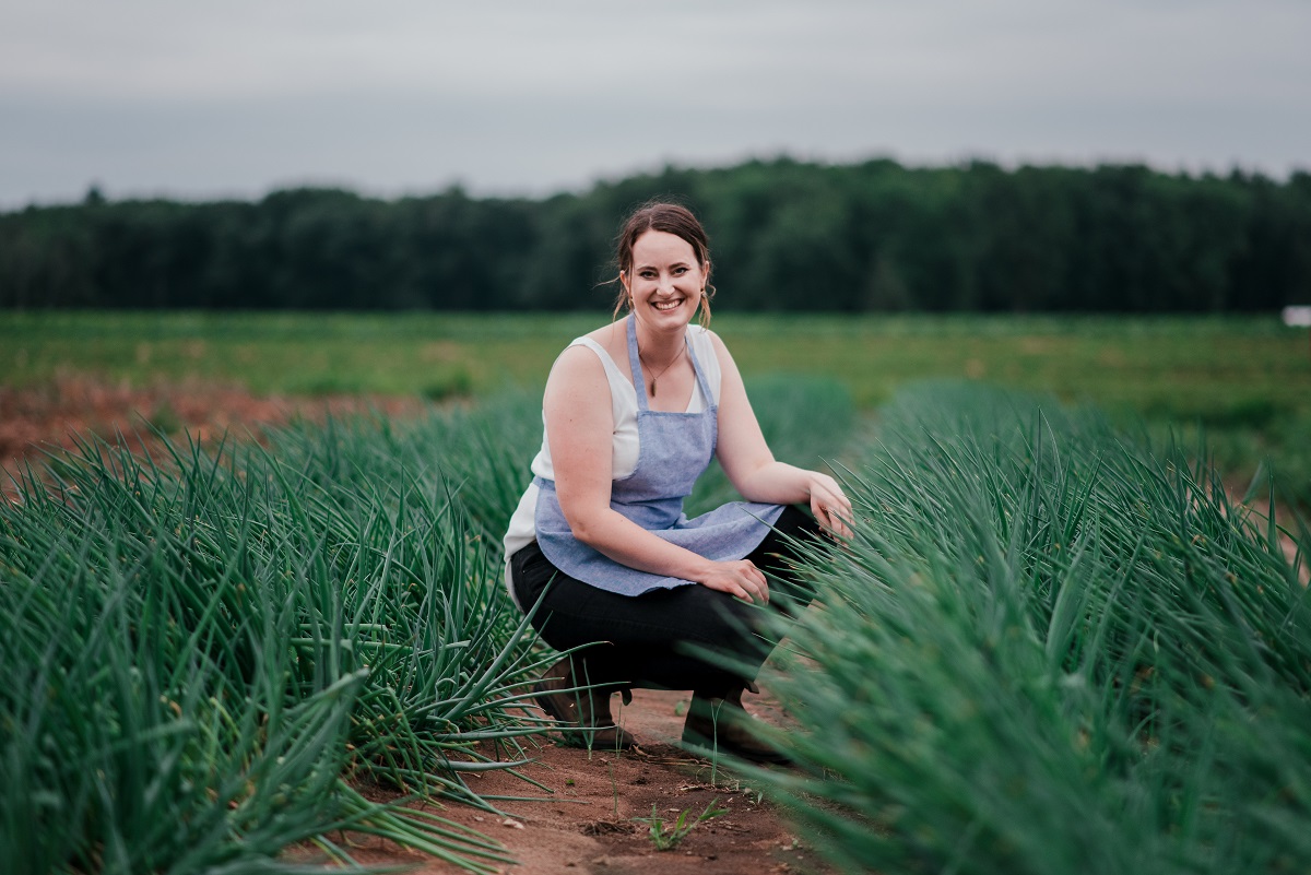 Alex in the patch getting ready for harvest brunch