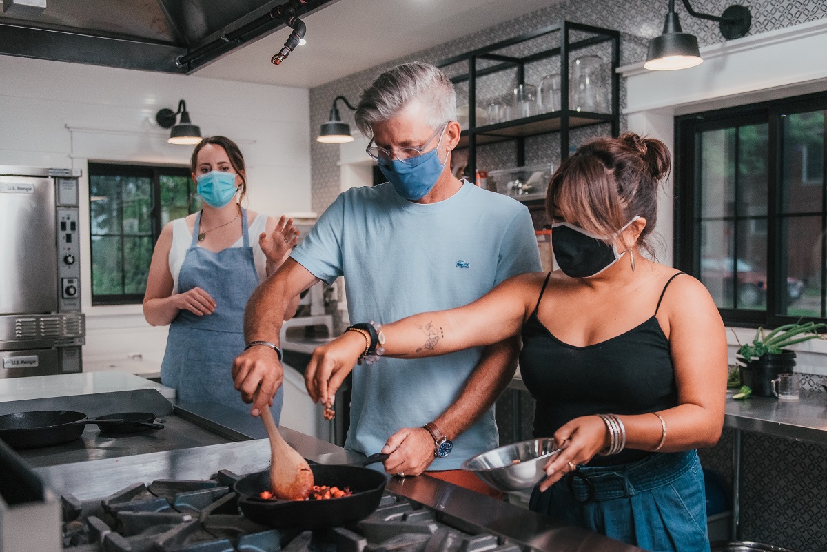 aggie and partner cooking a frittata at Thames River Melons