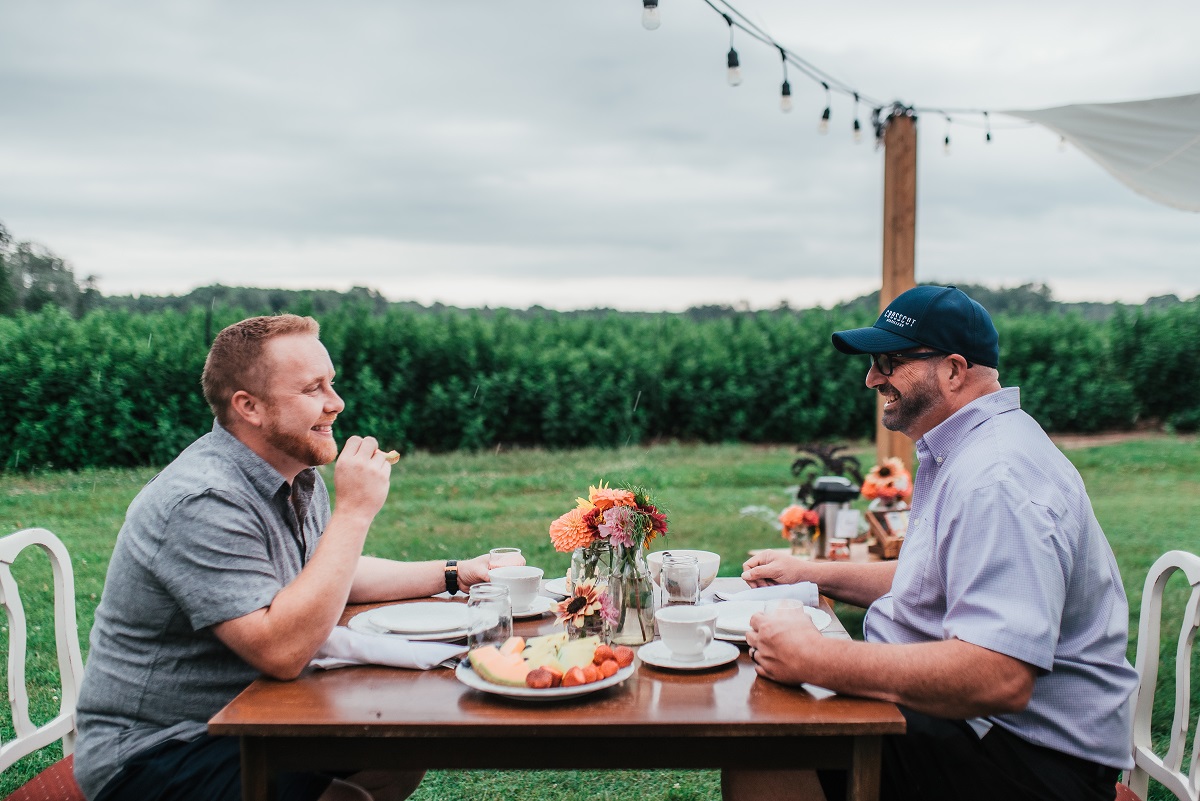 jason and rod enjoy brunch on the farm at thames river melons