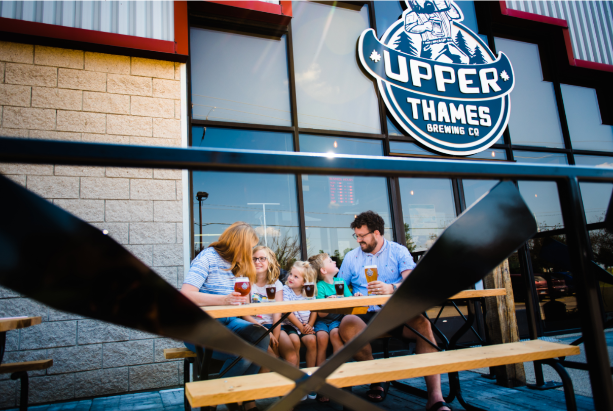 family on the patio at upper thames brewing company