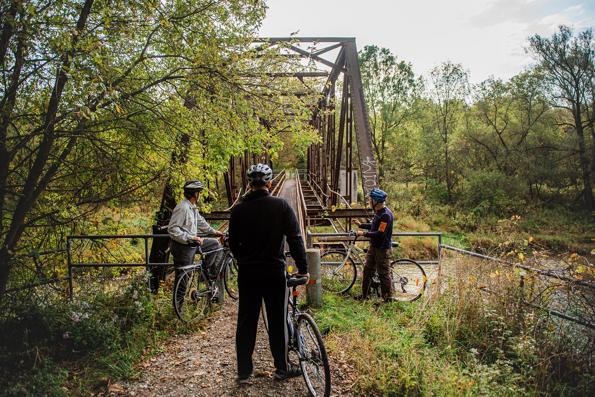 cycling up to an iron bridge